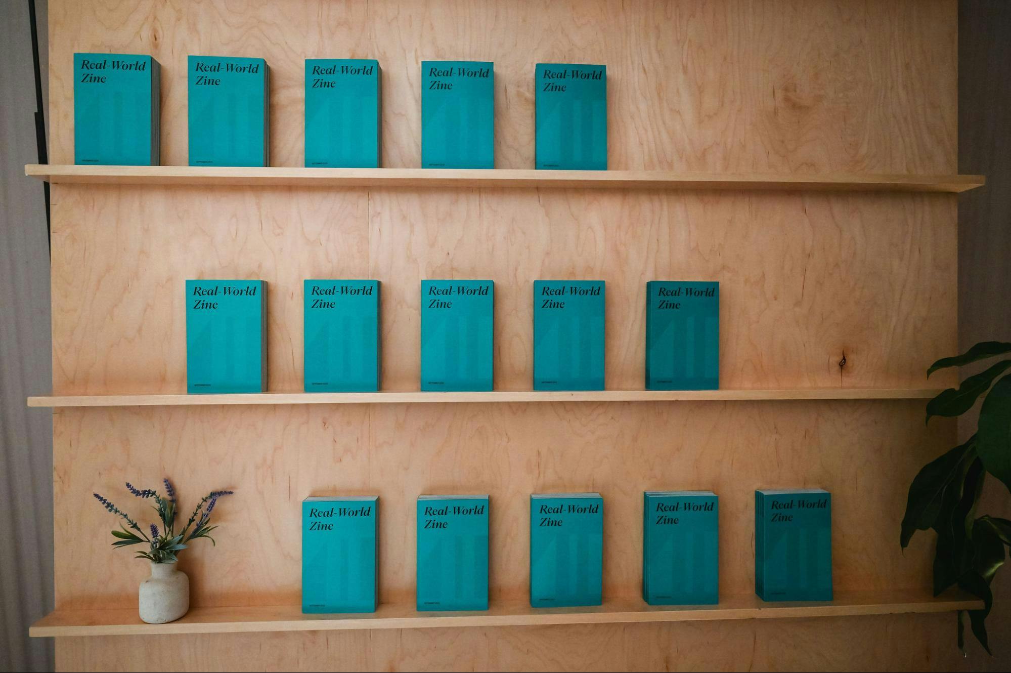 The Real-World Zine shelf at the Real-World Asset Summit 2023